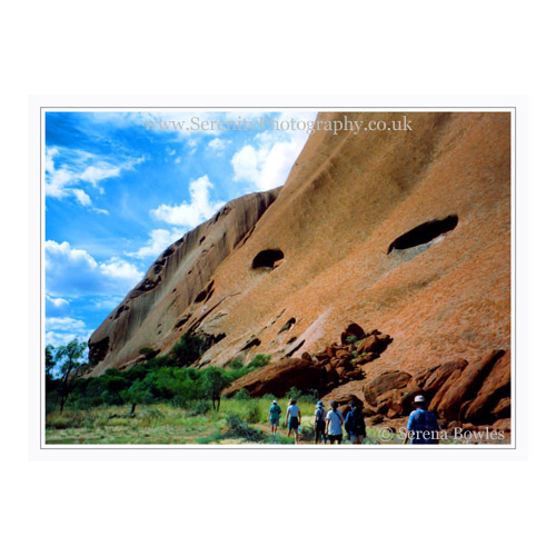 The base of Uluru - or Ayres Rock, the figures giving some idea of its size. Northern Territories, Australia